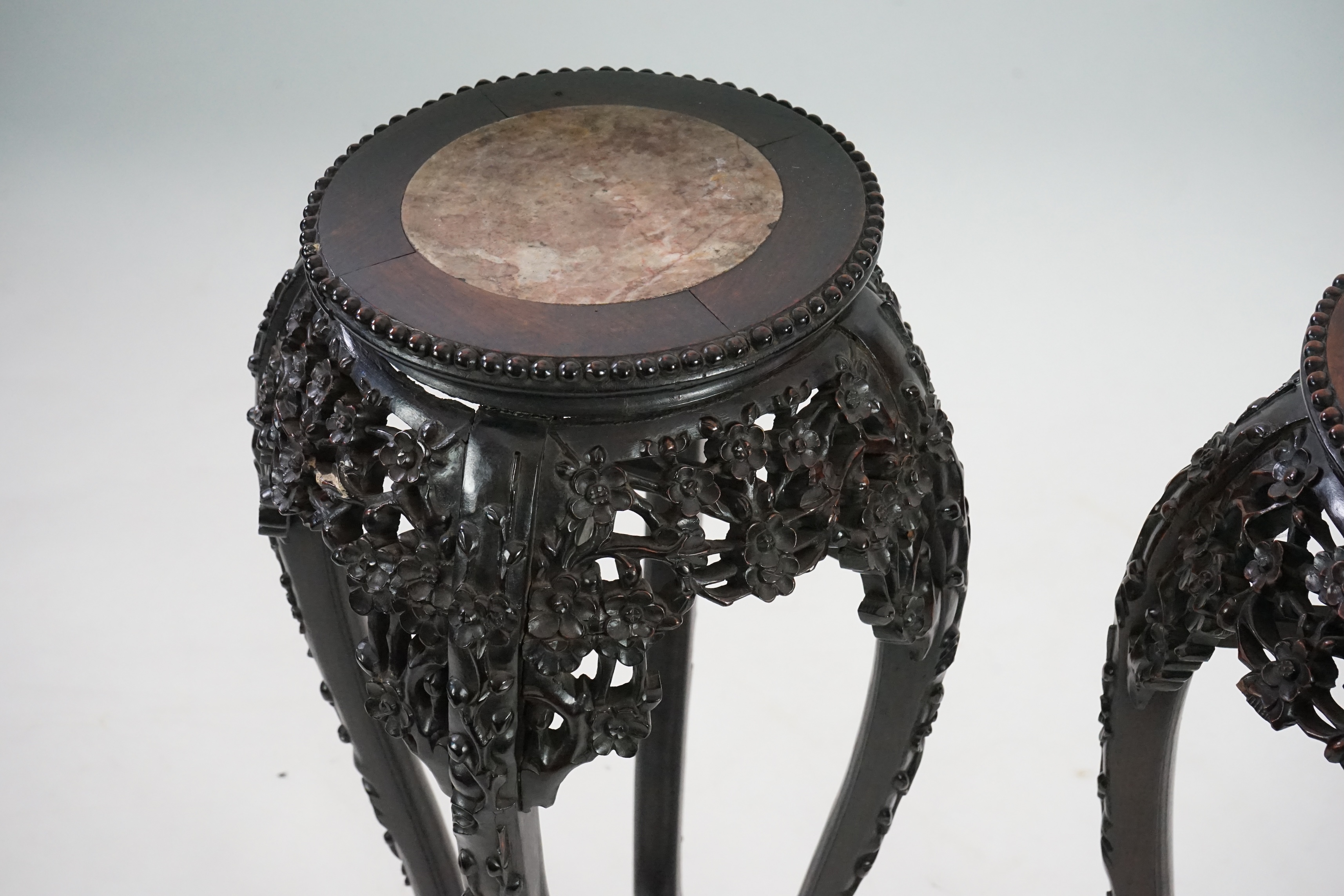 A pair of late 19th century Chinese hongmu and marble inset vase stands, height 91cm. Condition - fair to good